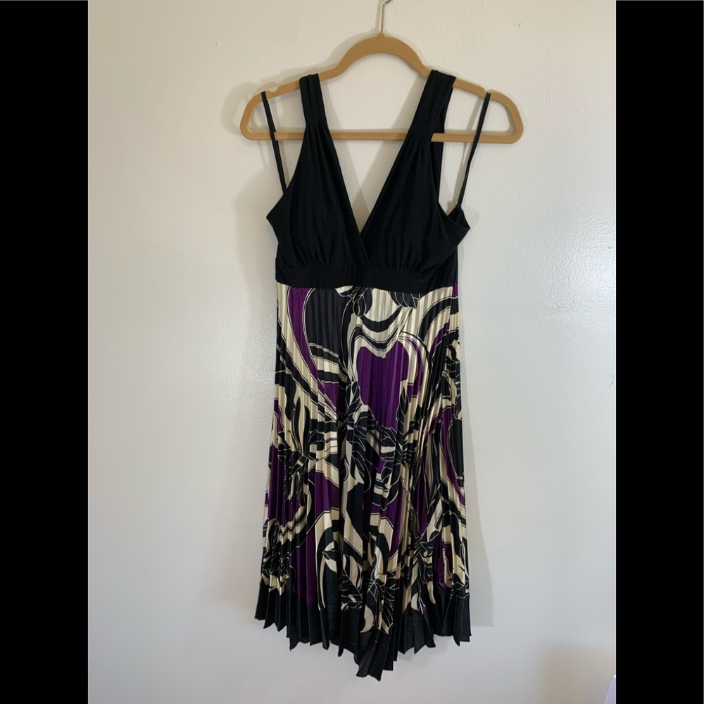 Large halter style top of dress. Pleated backless black with purple and cream